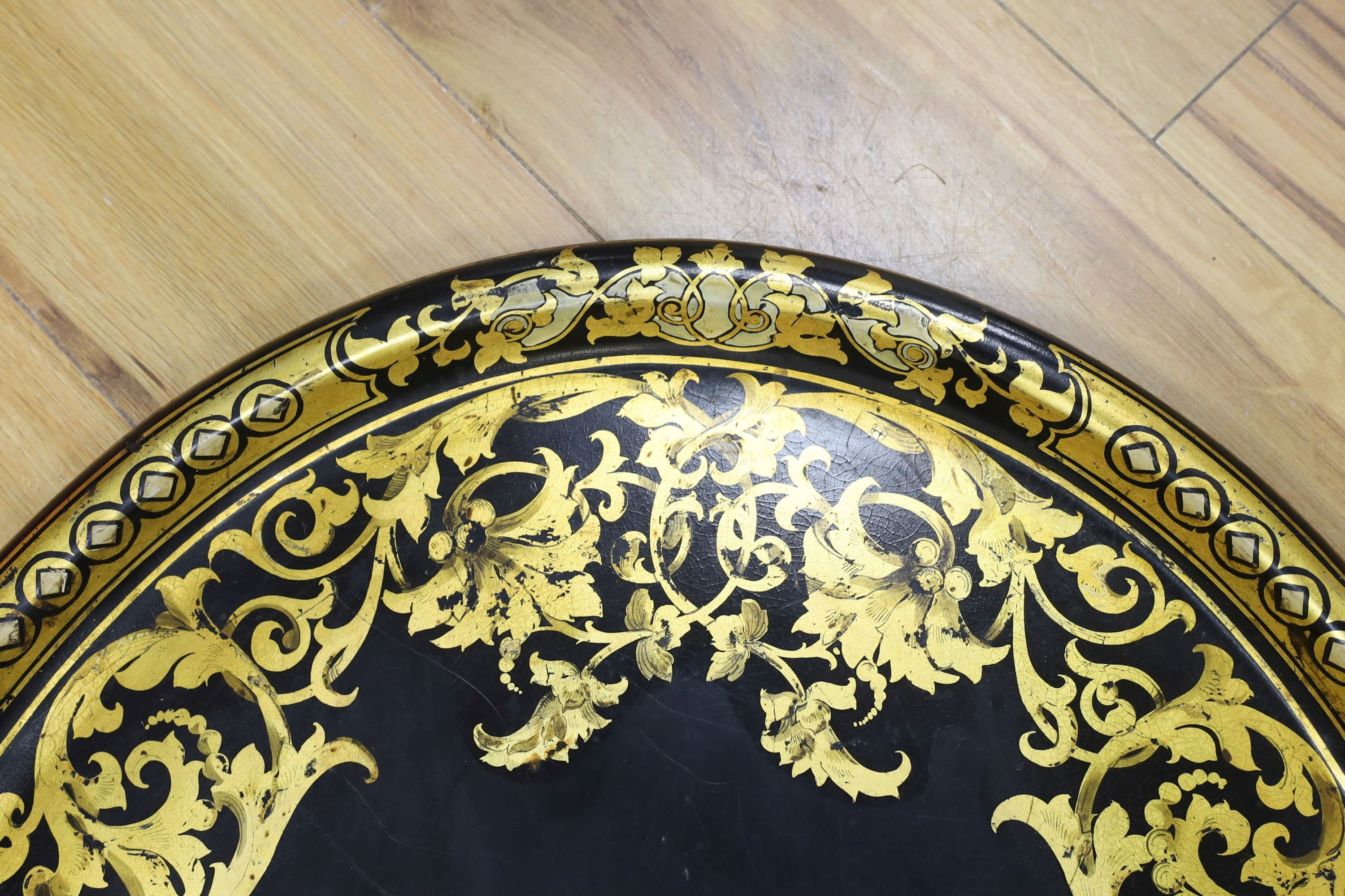 A large Victorian oval papier mache tray, 66cms wide.